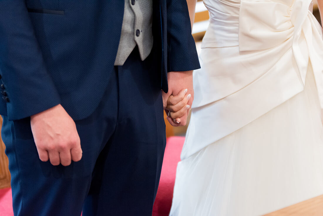 A bride and groom hold hands on their wedding day in County Clare